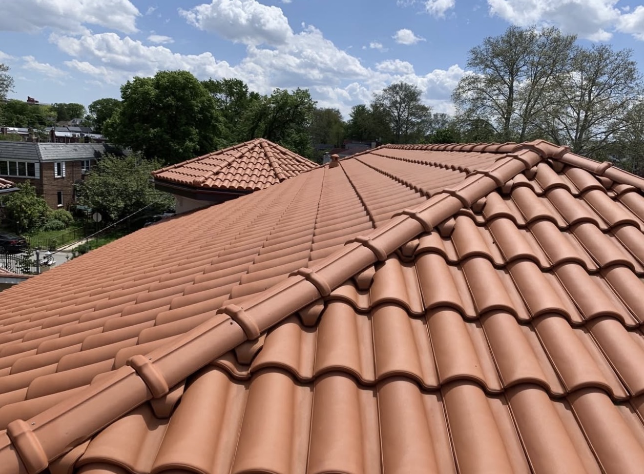 Terracotta clay tile roof under blue sky